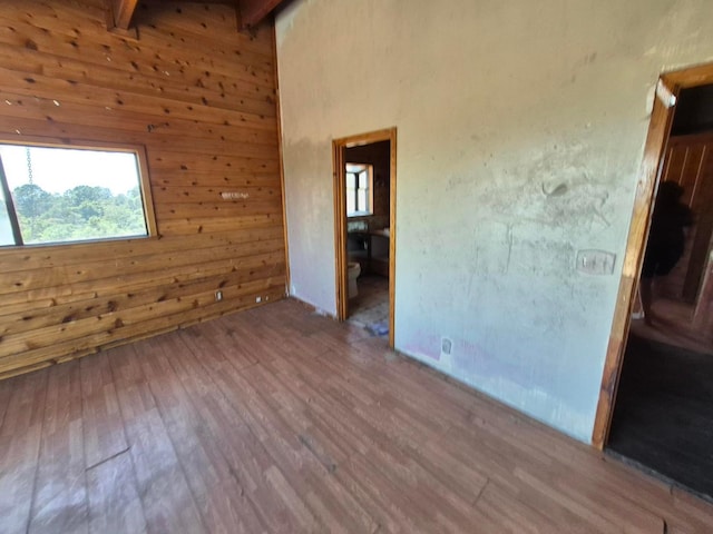 55766 Quail Hollow Ct, North Fork, CA 93643 - unfurnished room featuring wood walls, wood finished floors, and beam ceiling