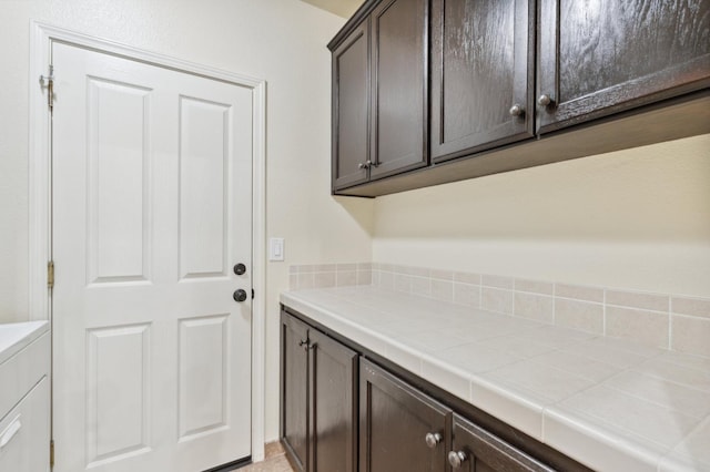 1158 E Hogan Ave, Fresno, CA 93730 - laundry room featuring cabinet space