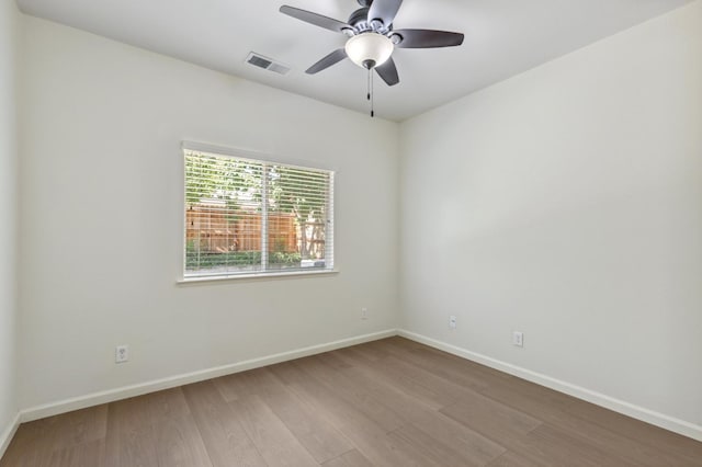 1158 E Hogan Ave, Fresno, CA 93730 - empty room with wood finished floors and ceiling fan