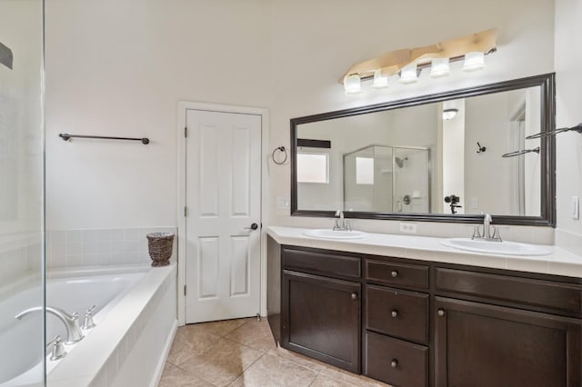 1158 E Hogan Ave, Fresno, CA 93730 - bathroom featuring a shower stall, a garden tub, double vanity, and tile patterned floors