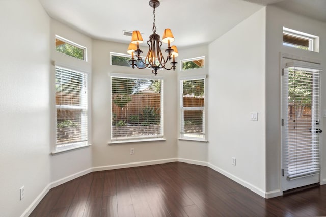 1158 E Hogan Ave, Fresno, CA 93730 - unfurnished dining area with a chandelier and dark wood-style flooring