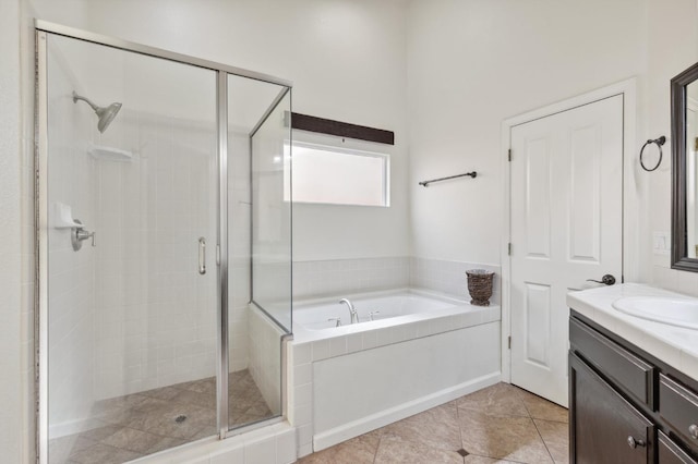 1158 E Hogan Ave, Fresno, CA 93730 - full bathroom featuring a stall shower, vanity, a bath, and tile patterned floors