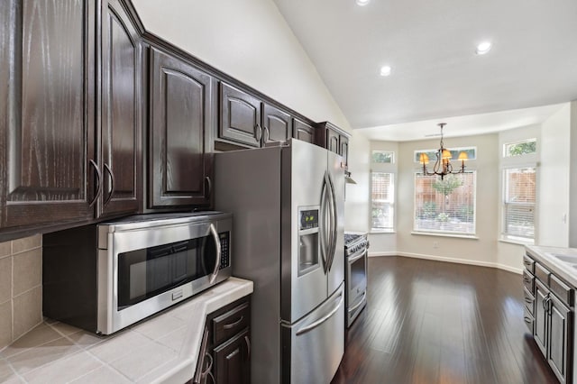 1158 E Hogan Ave, Fresno, CA 93730 - kitchen with appliances with stainless steel finishes, dark brown cabinetry, a chandelier, light countertops, and recessed lighting