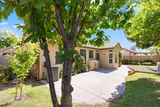 1158 E Hogan Ave, Fresno, CA 93730 - rear view of property featuring stucco siding and a patio