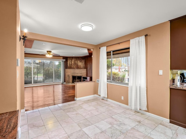 3110 N Del Mar Ave, Fresno, CA 93704 - kitchen featuring a fireplace, ceiling fan, and open floor plan