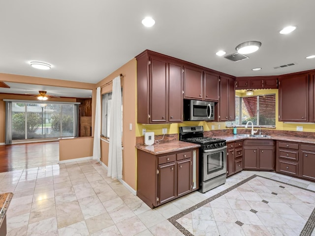 3110 N Del Mar Ave, Fresno, CA 93704 - kitchen with appliances with stainless steel finishes, healthy amount of natural light, ceiling fan, light stone counters, and recessed lighting