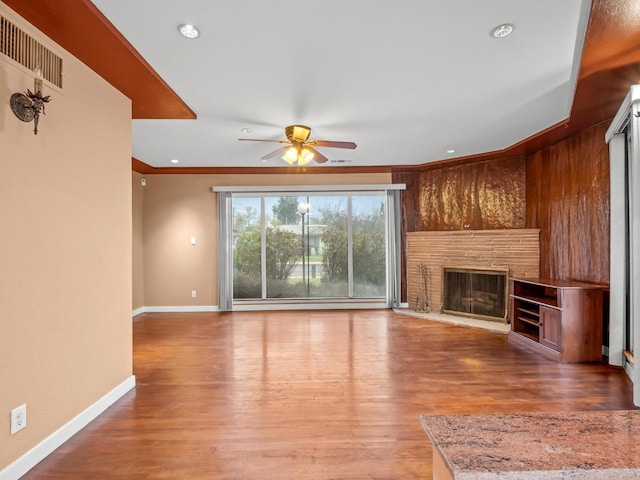 3110 N Del Mar Ave, Fresno, CA 93704 - unfurnished living room featuring ceiling fan, a fireplace, wood finished floors, crown molding, and recessed lighting