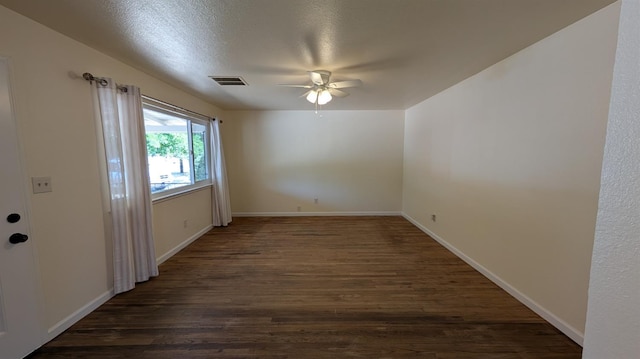 1405 N Lake St, Madera, CA 93638 - spare room with ceiling fan and dark wood-style floors