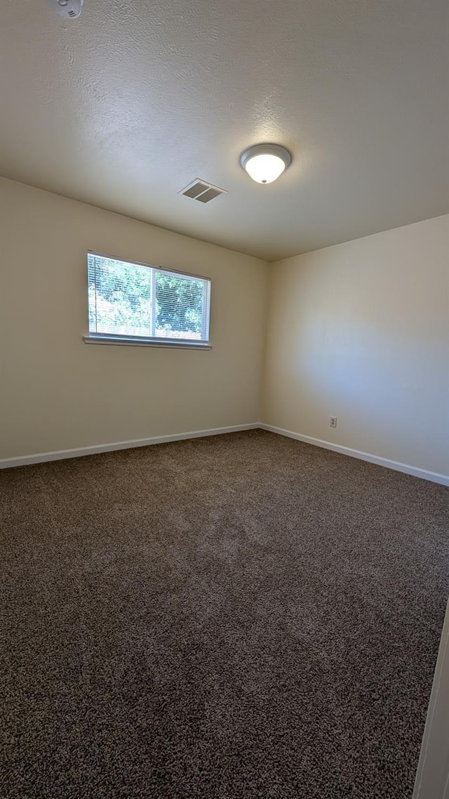 1405 N Lake St, Madera, CA 93638 - carpeted spare room with baseboards