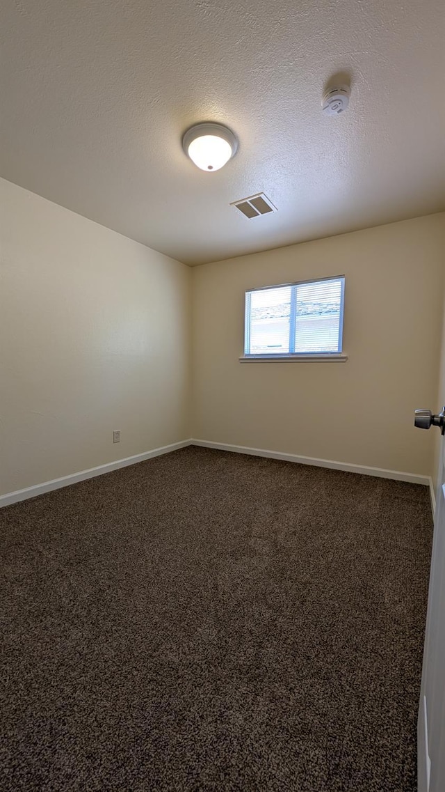 1405 N Lake St, Madera, CA 93638 - carpeted empty room with a smoke detector and a textured ceiling