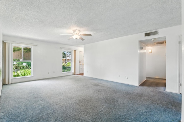 4909 N 7th St Unit S, Fresno, CA 93726 - carpeted spare room featuring plenty of natural light, ceiling fan, and a textured ceiling