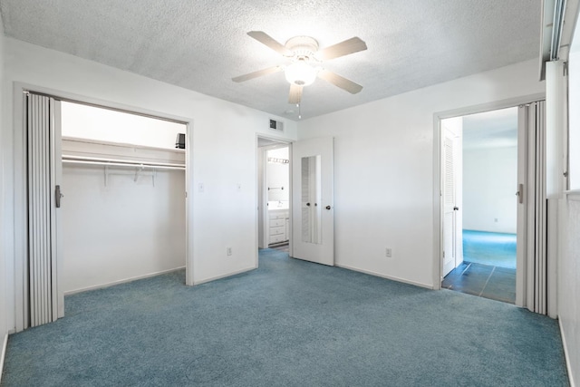 4909 N 7th St Unit S, Fresno, CA 93726 - unfurnished bedroom with carpet floors, a textured ceiling, a closet, and ceiling fan