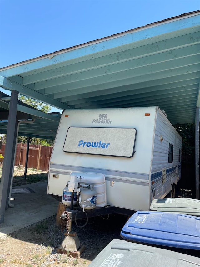 826 N W St, Visalia, CA 93291 - view of parking featuring a carport