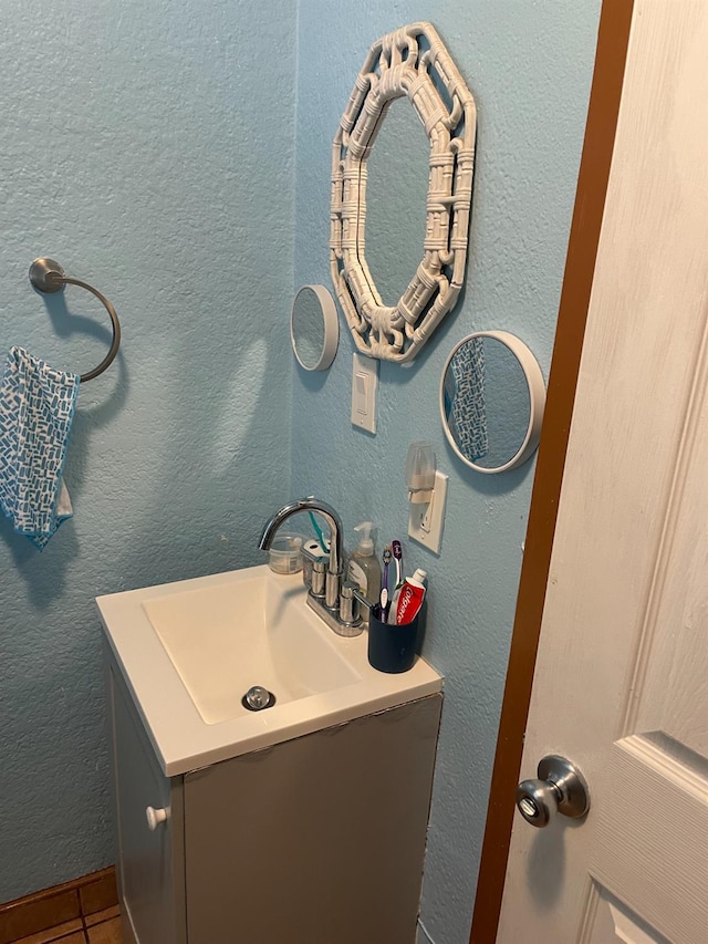 826 N W St, Visalia, CA 93291 - bathroom with vanity and tile patterned flooring
