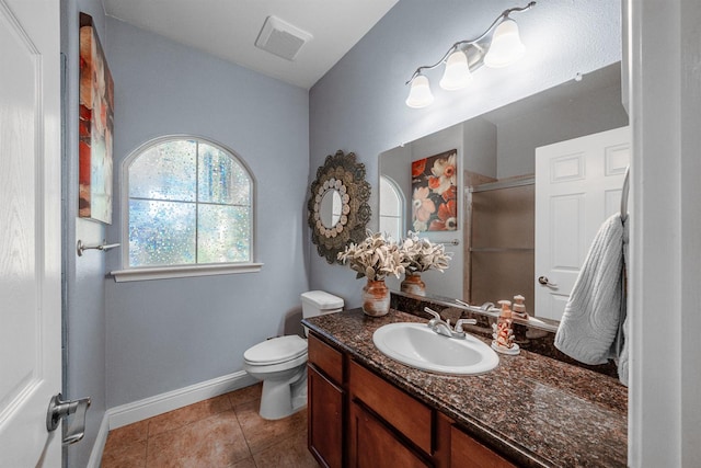 2148 N Ivanhoe Ave, Fresno, CA 93722 - bathroom featuring vanity, a shower with shower door, and tile patterned flooring