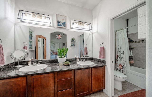 2148 N Ivanhoe Ave, Fresno, CA 93722 - bathroom with double vanity, shower / bathtub combination with curtain, and tile patterned flooring