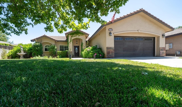 2148 N Ivanhoe Ave, Fresno, CA 93722 - mediterranean / spanish house featuring stucco siding, driveway, a front yard, and an attached garage