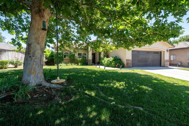 2148 N Ivanhoe Ave, Fresno, CA 93722 - view of property hidden behind natural elements featuring driveway, an attached garage, a front yard, stucco siding, and stone siding