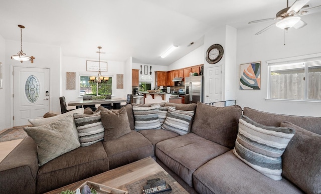 2148 N Ivanhoe Ave, Fresno, CA 93722 - living area with plenty of natural light, ceiling fan, lofted ceiling, and a chandelier