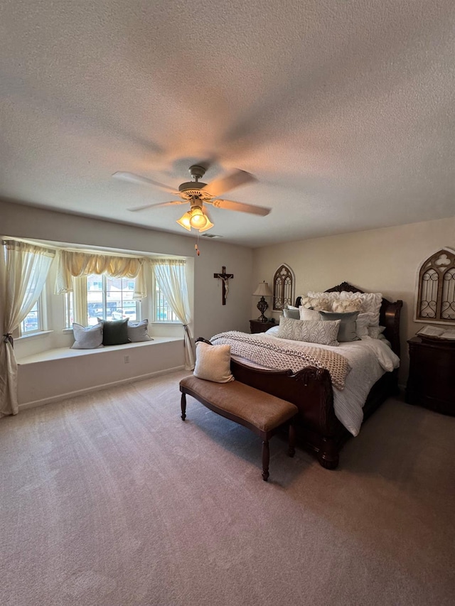 605 W Russell Ave, Visalia, CA 93277 - carpeted bedroom with a textured ceiling, multiple windows, and ceiling fan