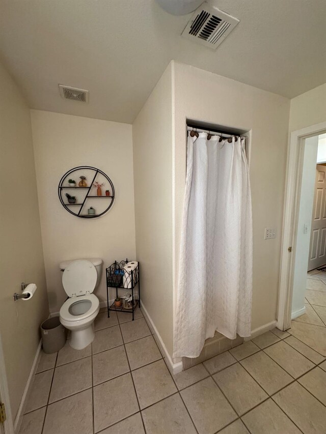 605 W Russell Ave, Visalia, CA 93277 - bathroom featuring tile patterned flooring and curtained shower
