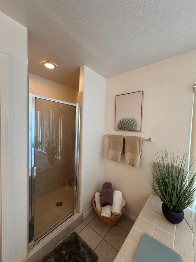 605 W Russell Ave, Visalia, CA 93277 - full bathroom with tile patterned flooring, a shower stall, recessed lighting, and a textured ceiling