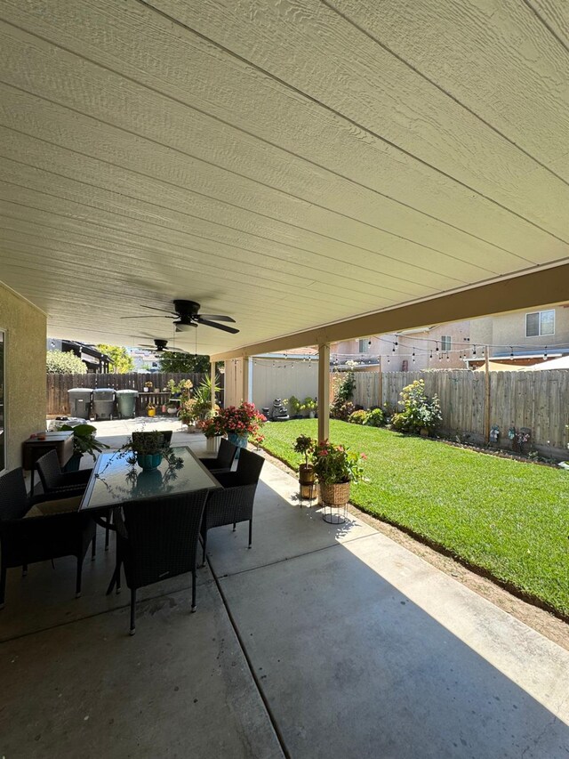 605 W Russell Ave, Visalia, CA 93277 - fenced backyard featuring a patio, a ceiling fan, and outdoor dining area