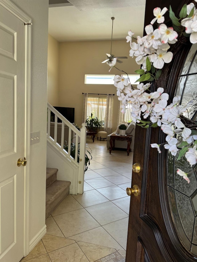 605 W Russell Ave, Visalia, CA 93277 - foyer entrance with stairway, light tile patterned flooring, and ceiling fan