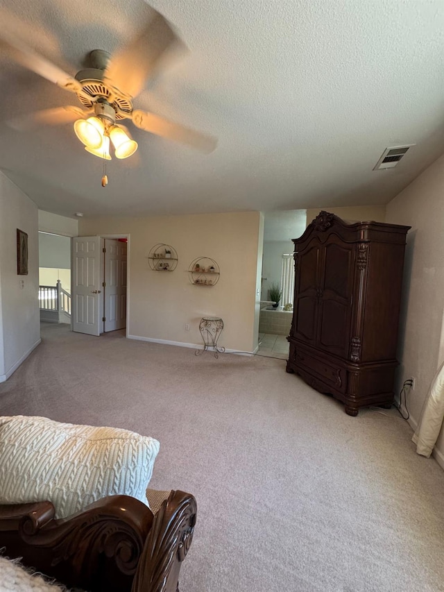 605 W Russell Ave, Visalia, CA 93277 - bedroom featuring light carpet, a textured ceiling, and ceiling fan
