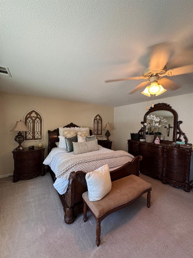 605 W Russell Ave, Visalia, CA 93277 - carpeted bedroom with a ceiling fan and a textured ceiling