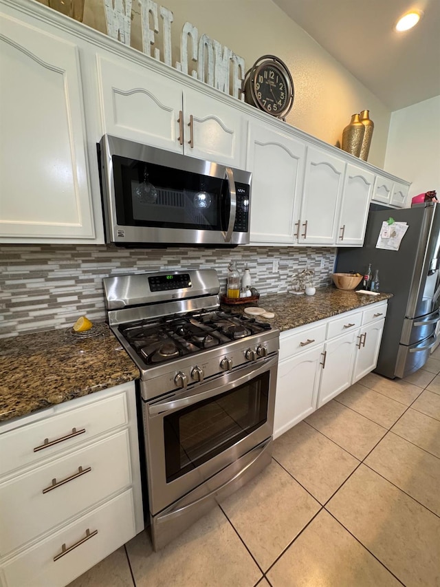605 W Russell Ave, Visalia, CA 93277 - kitchen featuring appliances with stainless steel finishes, white cabinets, backsplash, and light tile patterned floors