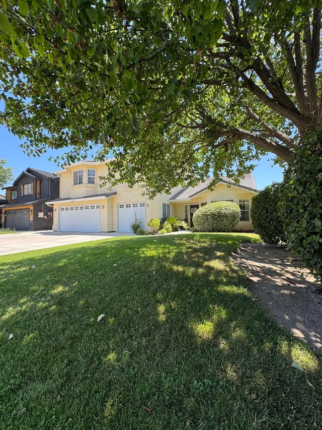 605 W Russell Ave, Visalia, CA 93277 - view of front of property with an attached garage, a front yard, and concrete driveway