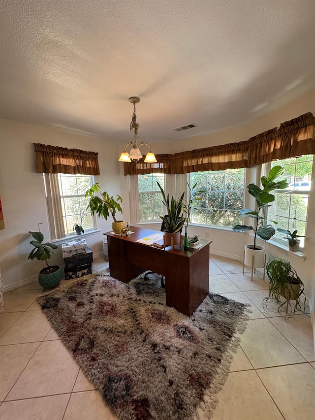 605 W Russell Ave, Visalia, CA 93277 - office space with light tile patterned floors, plenty of natural light, and a textured ceiling
