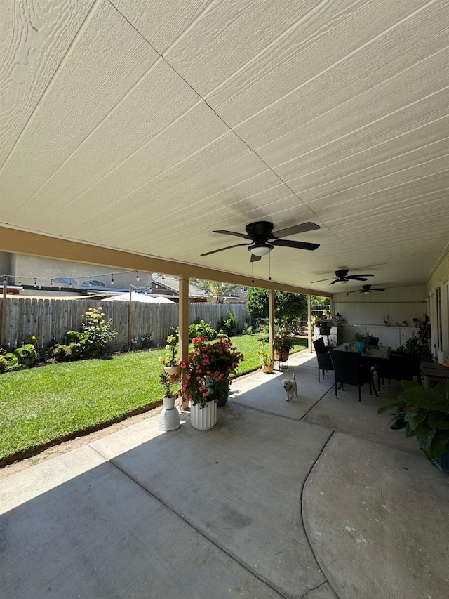 605 W Russell Ave, Visalia, CA 93277 - fenced backyard with a patio, ceiling fan, and outdoor lounge area