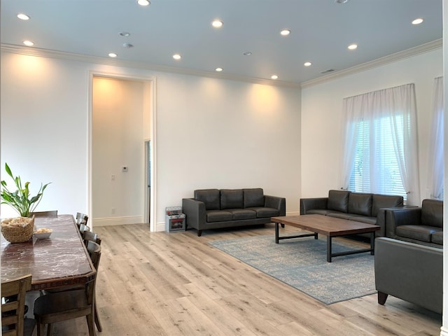 living room with crown molding, light wood-style floors, and recessed lighting