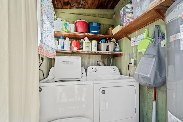 242 Hamlet St, Lemoore, CA 93245 - laundry area with washer and clothes dryer, secured water heater, and wood walls