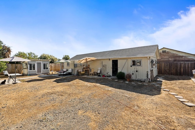 242 Hamlet St, Lemoore, CA 93245 - back of property with a patio area and a shingled roof