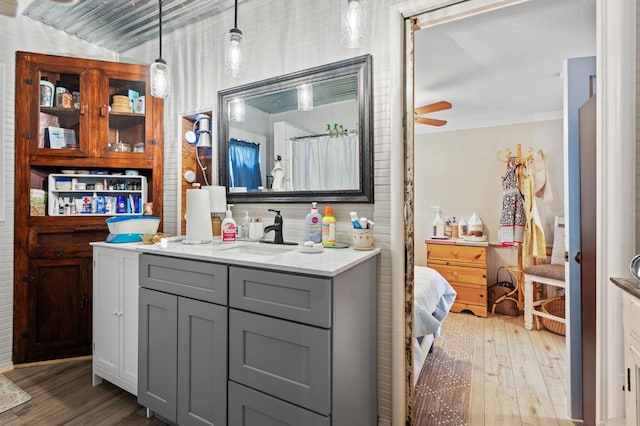 242 Hamlet St, Lemoore, CA 93245 - full bath with wood finished floors, vanity, ornamental molding, ceiling fan, and a shower with shower curtain