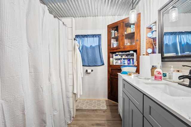 242 Hamlet St, Lemoore, CA 93245 - bathroom with wood finished floors, vanity, and a shower with curtain