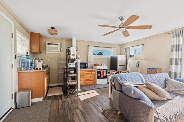 242 Hamlet St, Lemoore, CA 93245 - living room featuring a wall mounted air conditioner, dark wood-style flooring, and ceiling fan