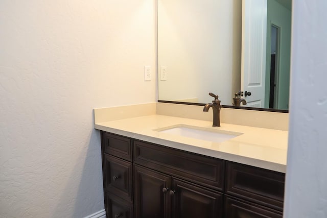 4249 N Waterside Dr, Clovis, CA 93619 - bathroom featuring vanity and a textured wall