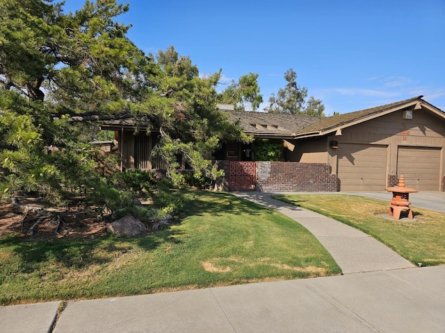 1 Adams Dr, Chowchilla, CA 93610 - view of front of home featuring a garage, a front yard, concrete driveway, and brick siding