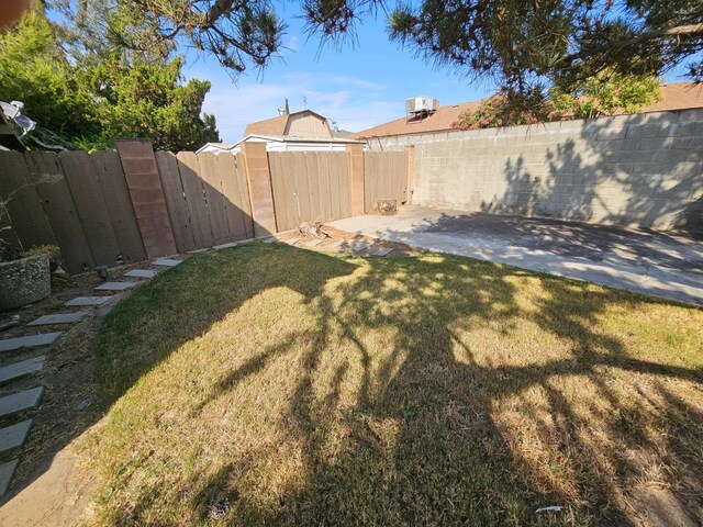 1 Adams Dr, Chowchilla, CA 93610 - fenced backyard featuring a patio area and a gate