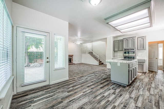 1224 Oak Ave, Clovis, CA 93611 - kitchen featuring gray cabinets, tile countertops, dark wood finished floors, and ceiling fan