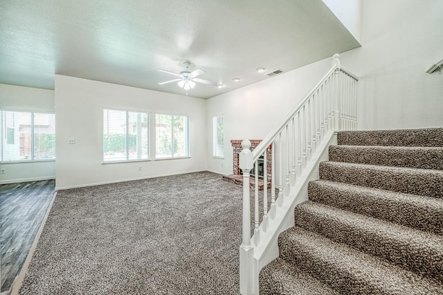 1224 Oak Ave, Clovis, CA 93611 - stairs featuring a ceiling fan, carpet flooring, and wood finished floors