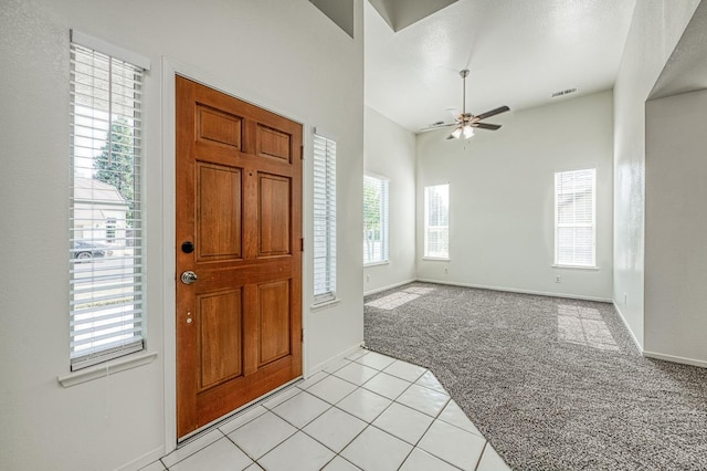 1224 Oak Ave, Clovis, CA 93611 - entrance foyer with light carpet, healthy amount of natural light, a ceiling fan, and light tile patterned floors