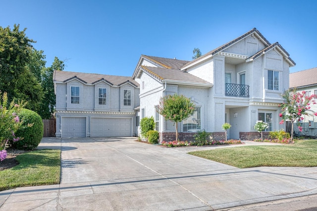 1224 Oak Ave, Clovis, CA 93611 - view of front of home with driveway, an attached garage, stucco siding, and a front lawn