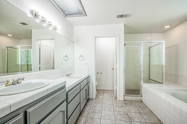 1224 Oak Ave, Clovis, CA 93611 - full bath featuring double vanity, a shower stall, a bath, and tile patterned flooring