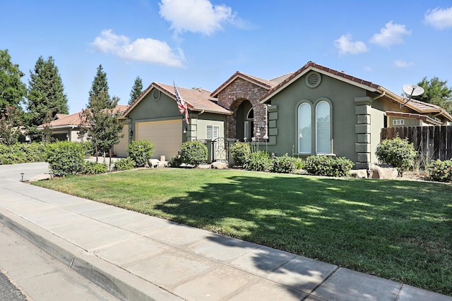 17024 Granite Falls Way, Chowchilla, CA 93610 - single story home with stucco siding, a garage, a tiled roof, and stone siding