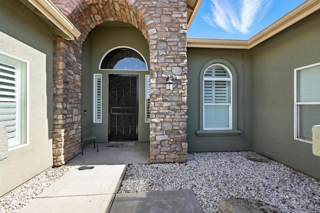 17024 Granite Falls Way, Chowchilla, CA 93610 - doorway to property with stone siding and stucco siding